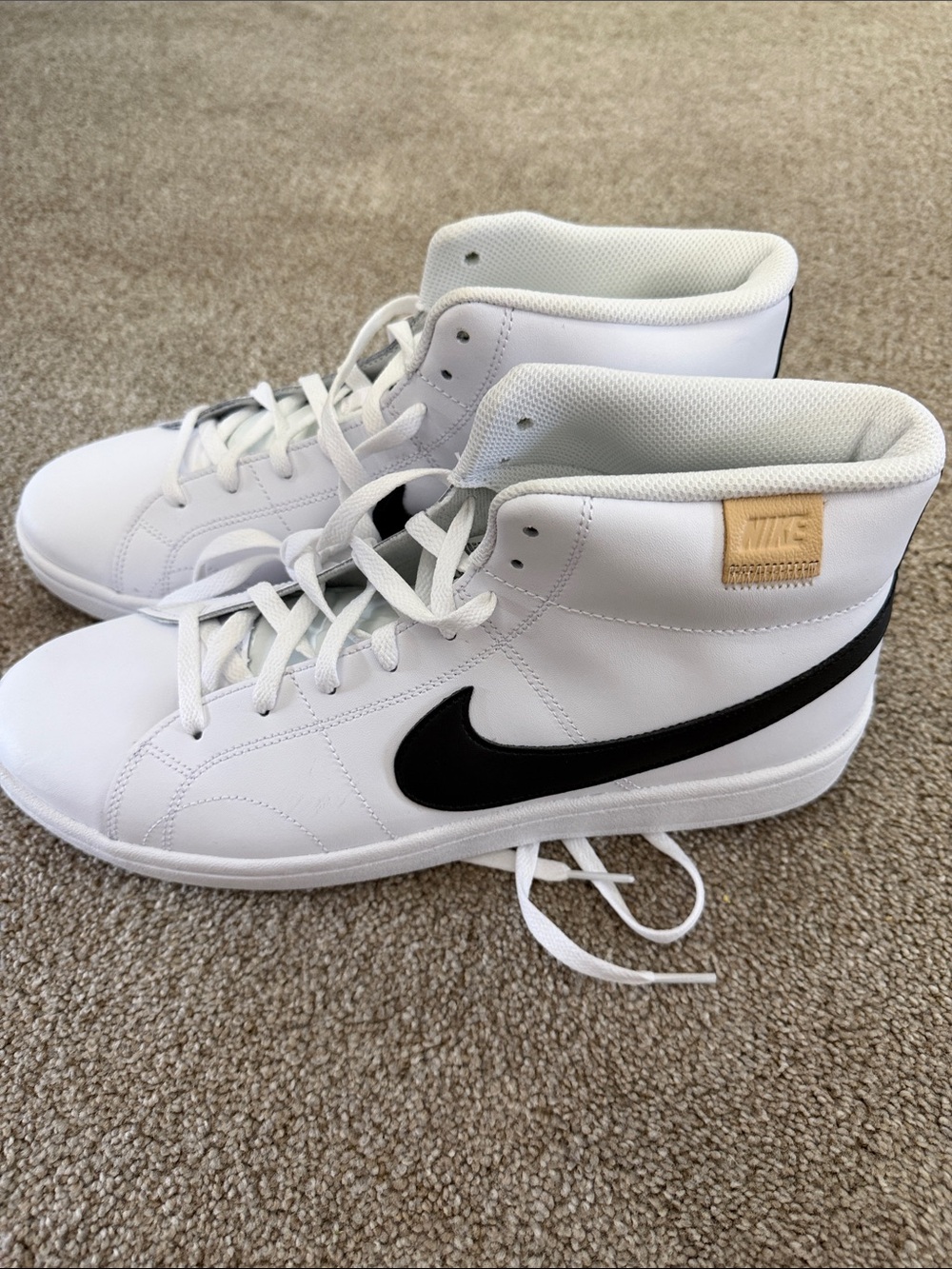 Nike White High-Top Sneakers with Black Swoosh and Tan Patch